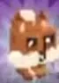 Brown Acorn Squirrel with pale cheeks and pointed ears.
